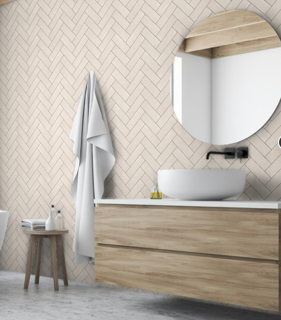 Zellige beige herringbone pattern 6,5X20 in a bathroom with wooden vanity and white towels
