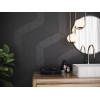 Carrelage uni noir avec motifs géométriques dans une salle de bain épurée avec des éléments blancs et bois, plantes vertes et éc